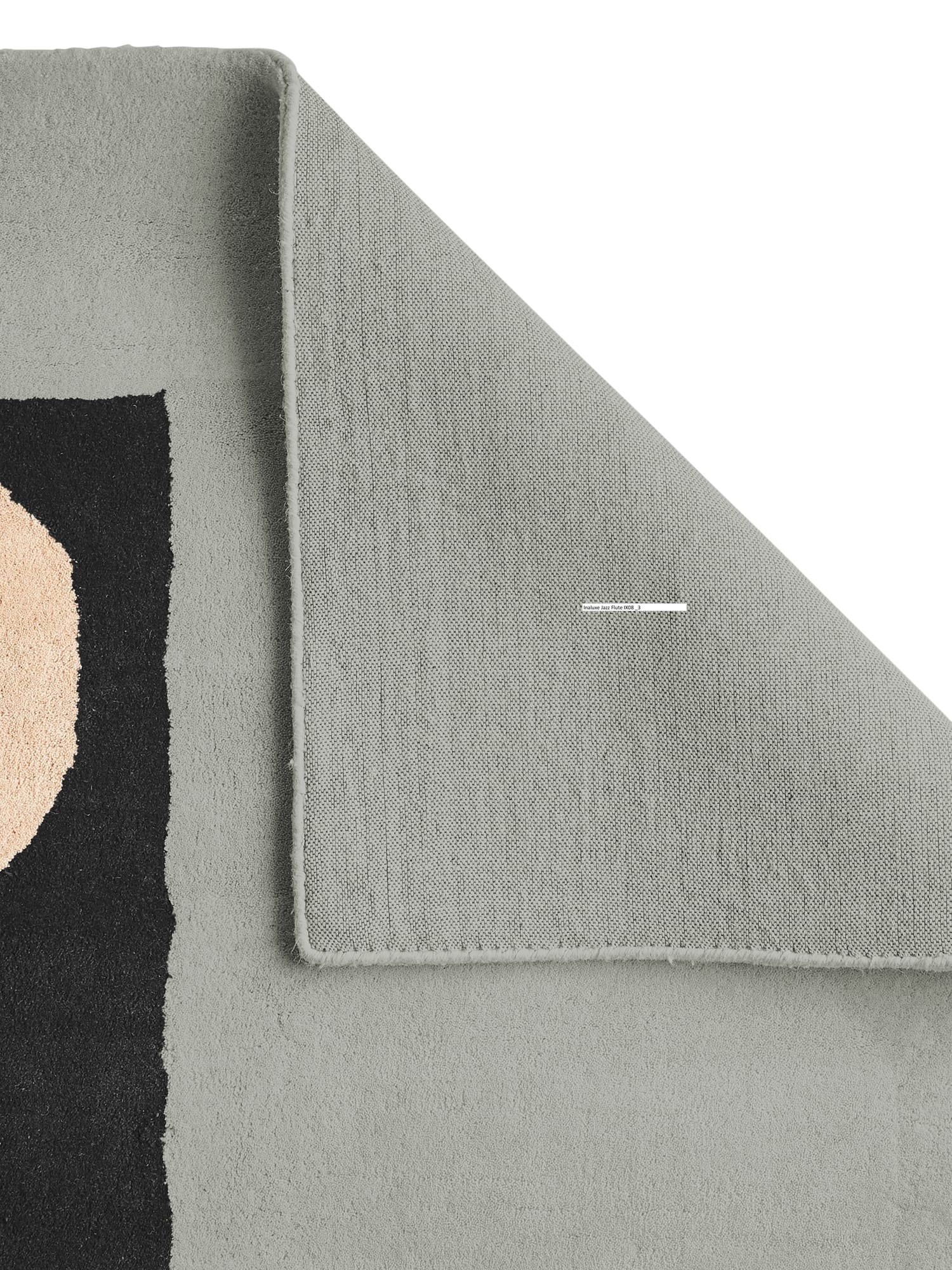 Inaluxe Jazz Flute rectangular rug in grey and cream with blue, yellow, pink and black shapes, with a corner folded back to show the underside.