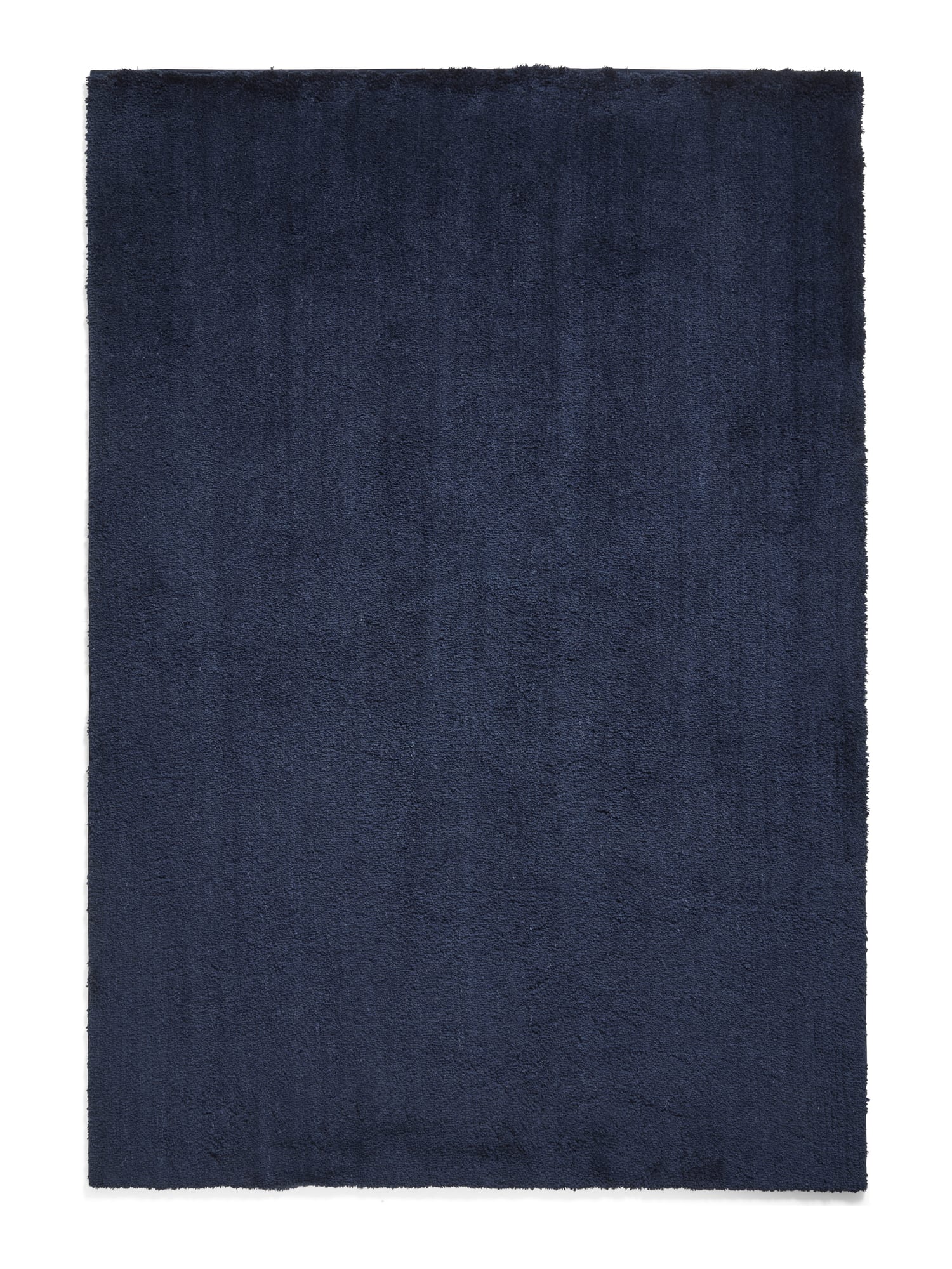 Riviera rectangular rug shown flat in navy, with a plain shaggy surface.