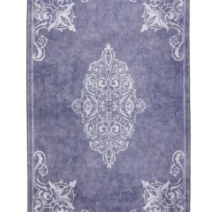 Sarabande rectangular rug shown flat in blue, with a pale ornamental centre with scrolling corner motifs.