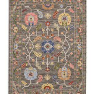 Suzani Branching Floral Black/Multi Wool-Blend Rug. Suzani Branching Floral rectangular rug shown flat in black and mixed colours, with large spaced floral motifs joined by branching lines.