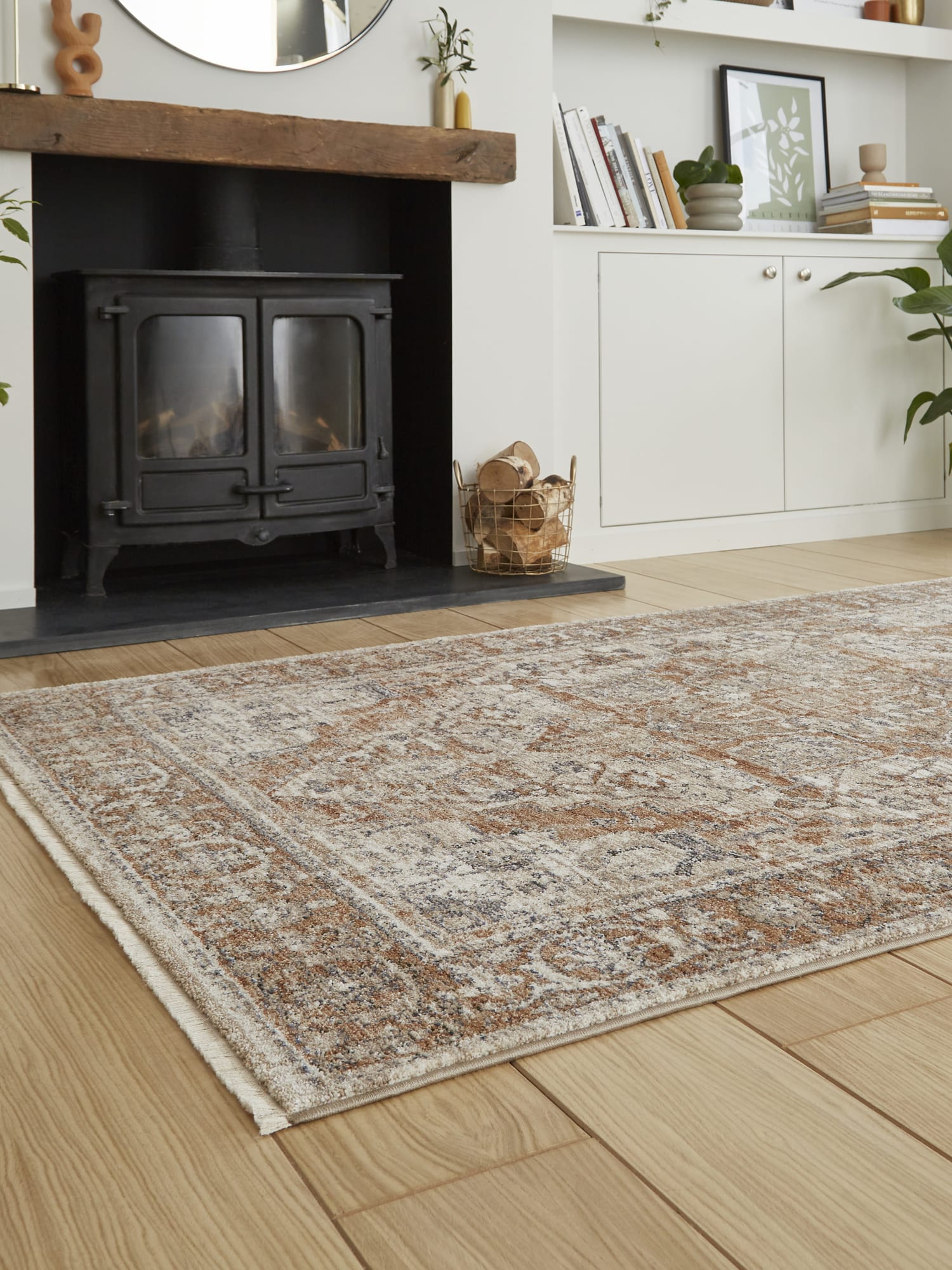 Vintage Medallion rectangular rug in terracotta, at a low angle in front of a stove.