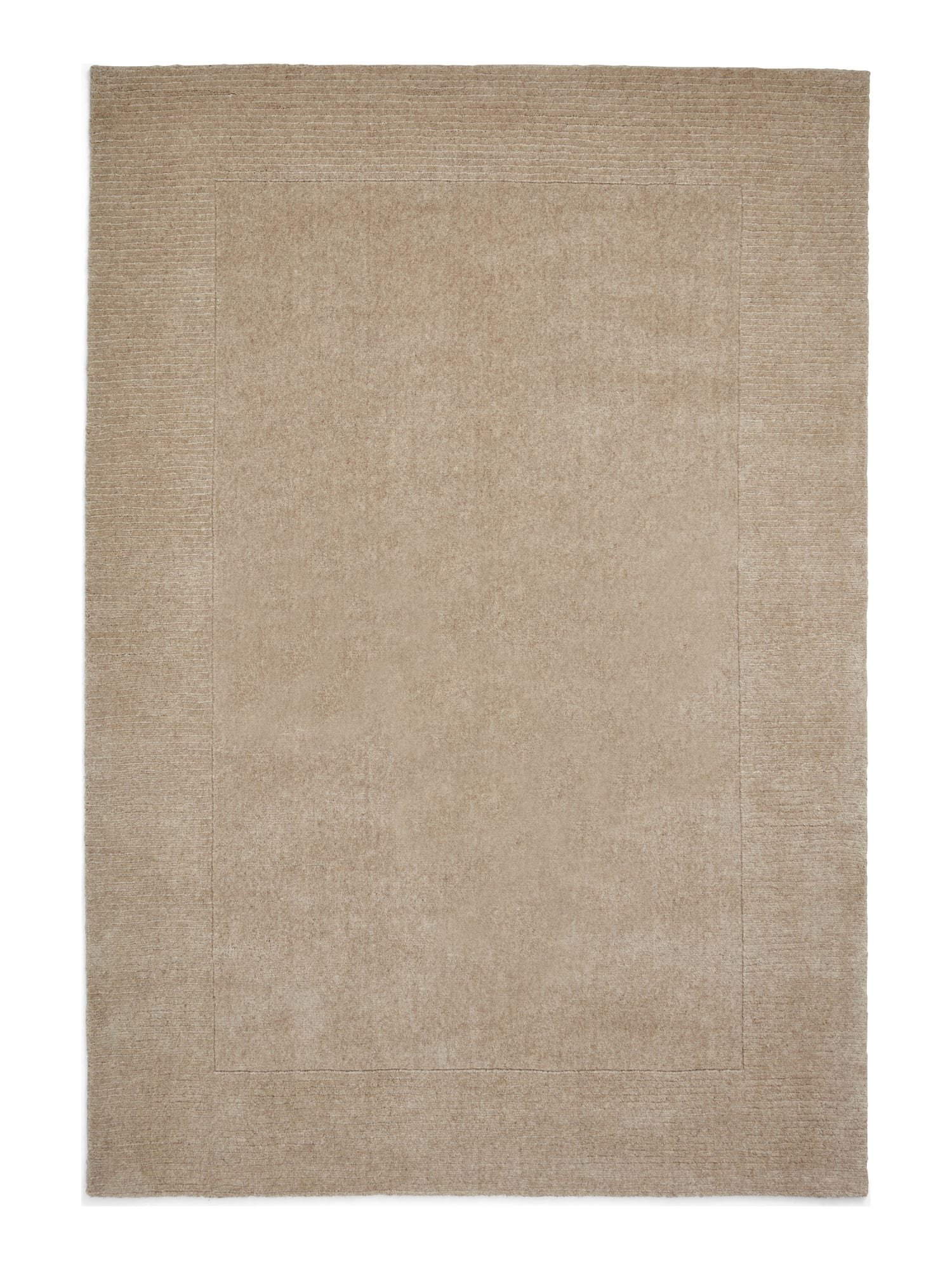 Windsor Border rectangular rug shown flat in natural, with a plain centre framed by a tonal textured border.