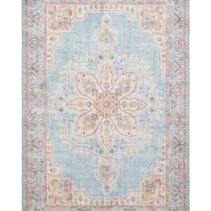 Zahra Washable rectangular rug shown flat in blue and beige, with a large flower-shaped central medallion within an ornate border.