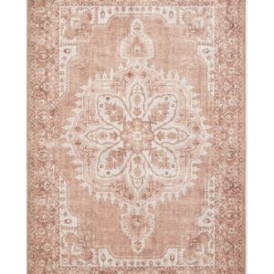 Zahra Washable rectangular rug shown flat in terracotta, with a large flower-shaped central medallion within an ornate border.